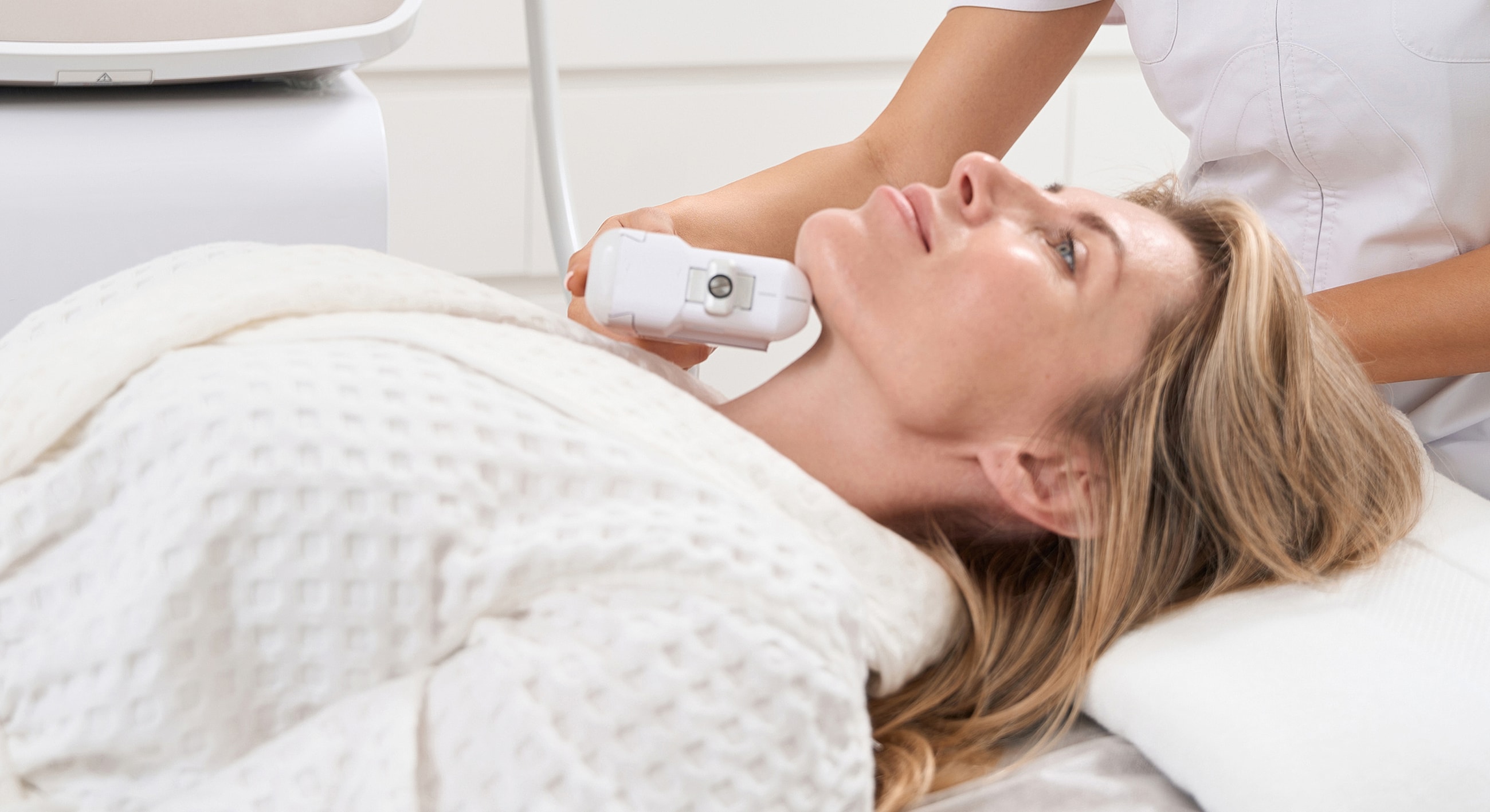Woman receiving skincare treatment in spa setting