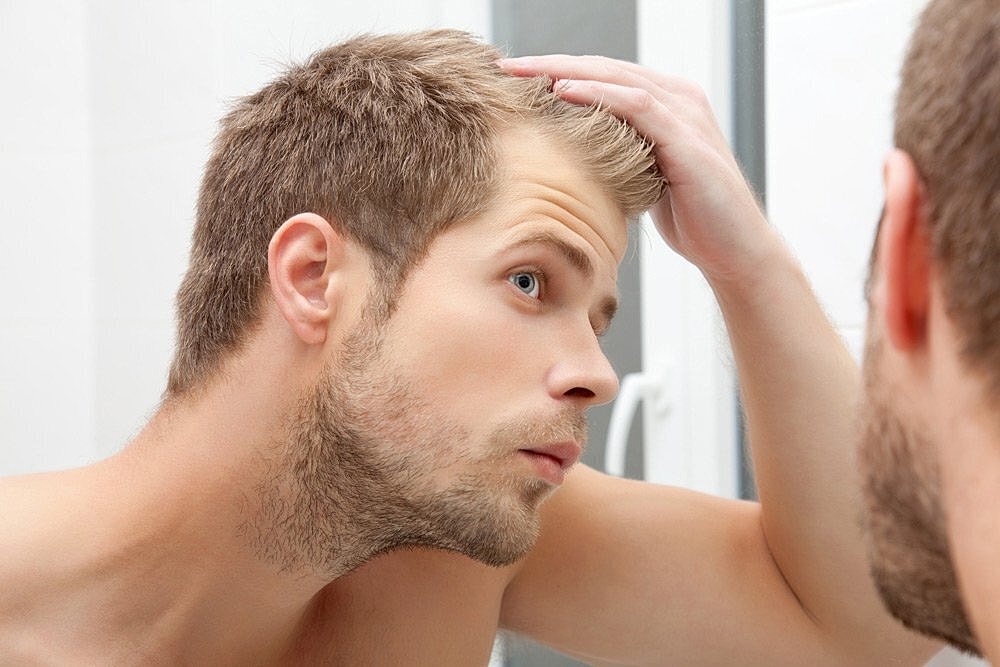 Woman reviewing modern hair restoration treatment options