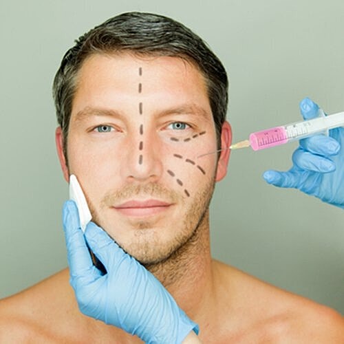 Man smiling after cosmetic treatments.