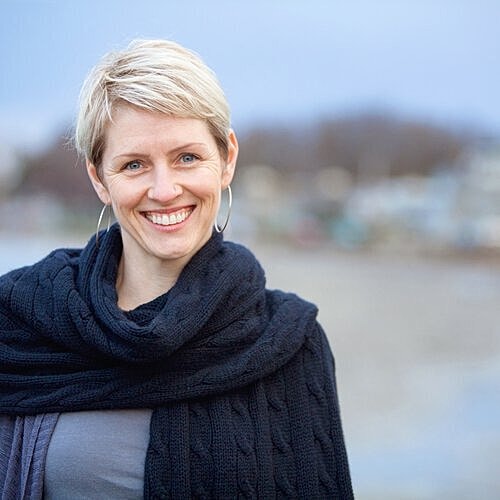 Woman caring for sun-exposed skin during summer