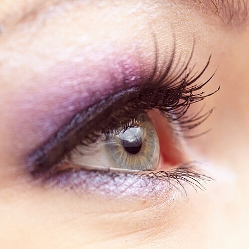 Pastel spring makeup palette with soft shadows.