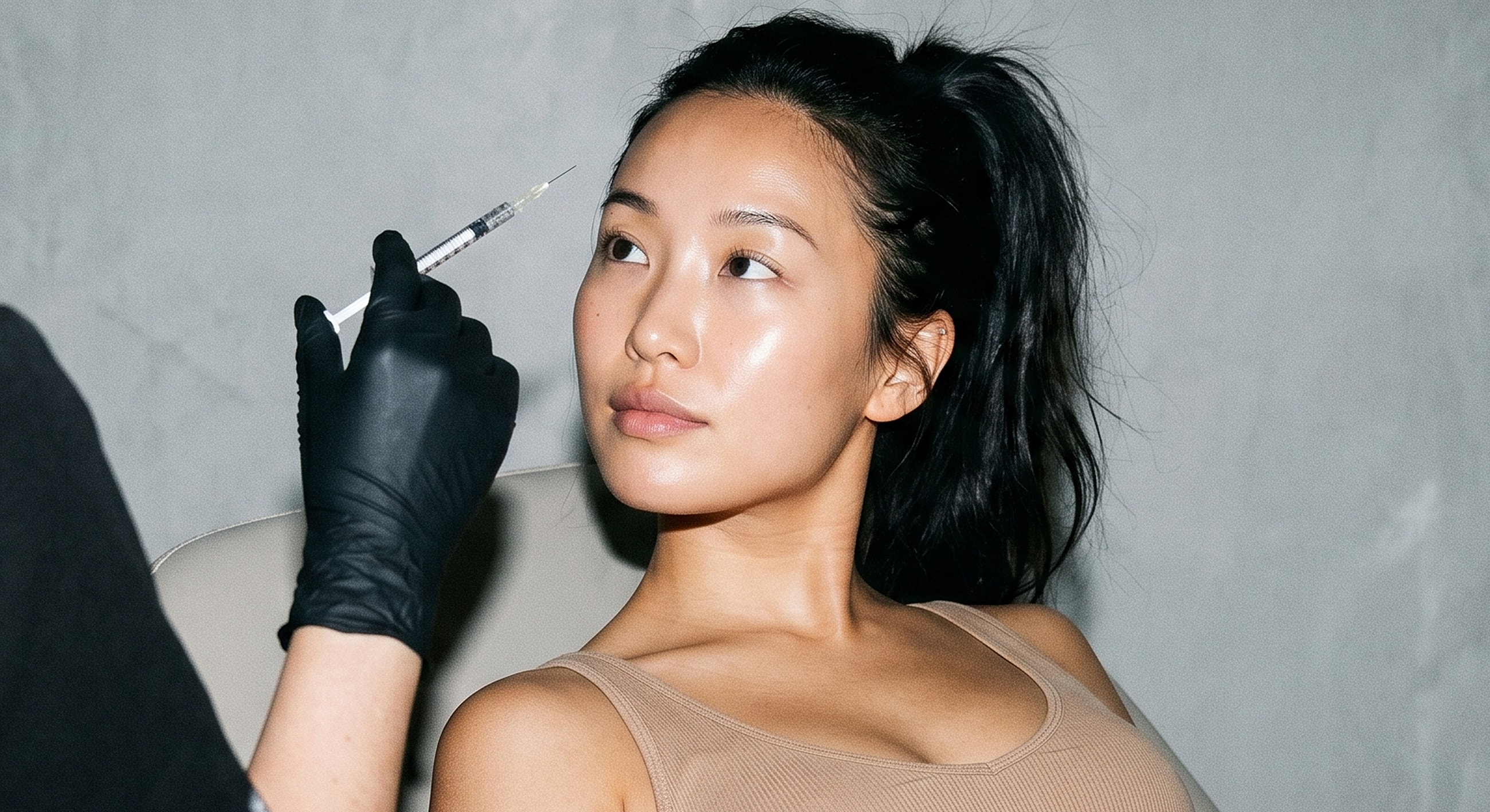 Woman receiving cosmetic treatment in a clinic.