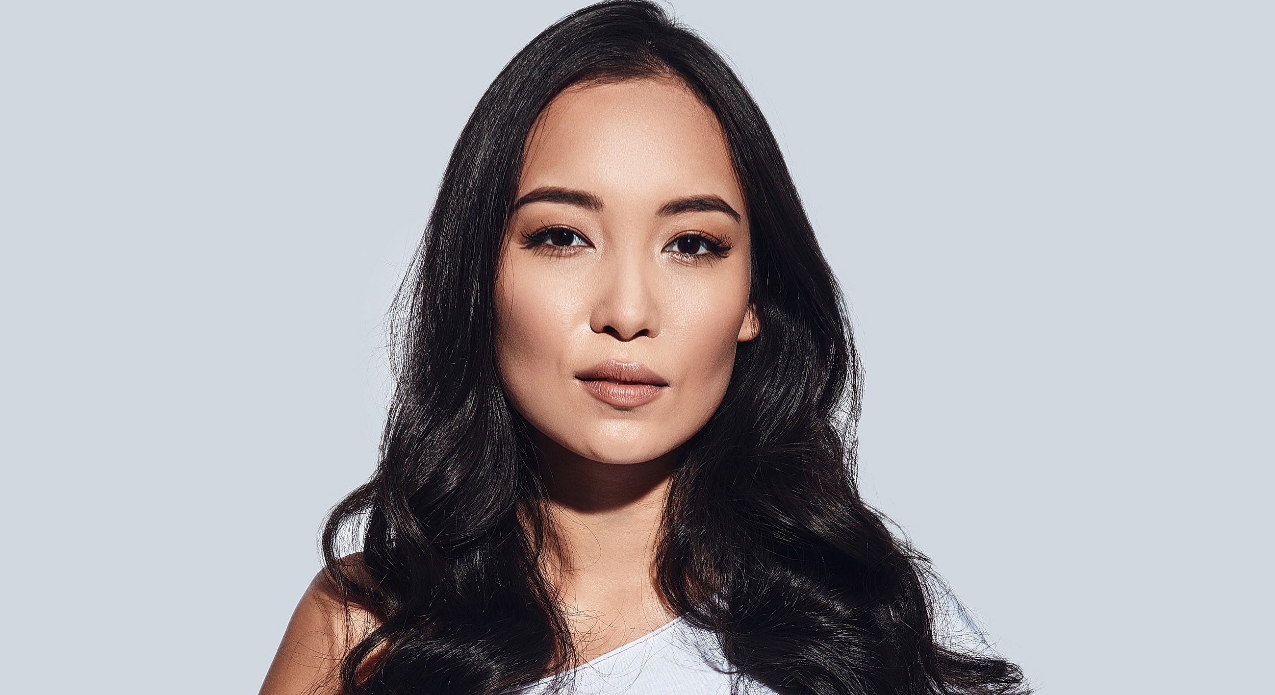Portrait of a woman with long, dark hair.