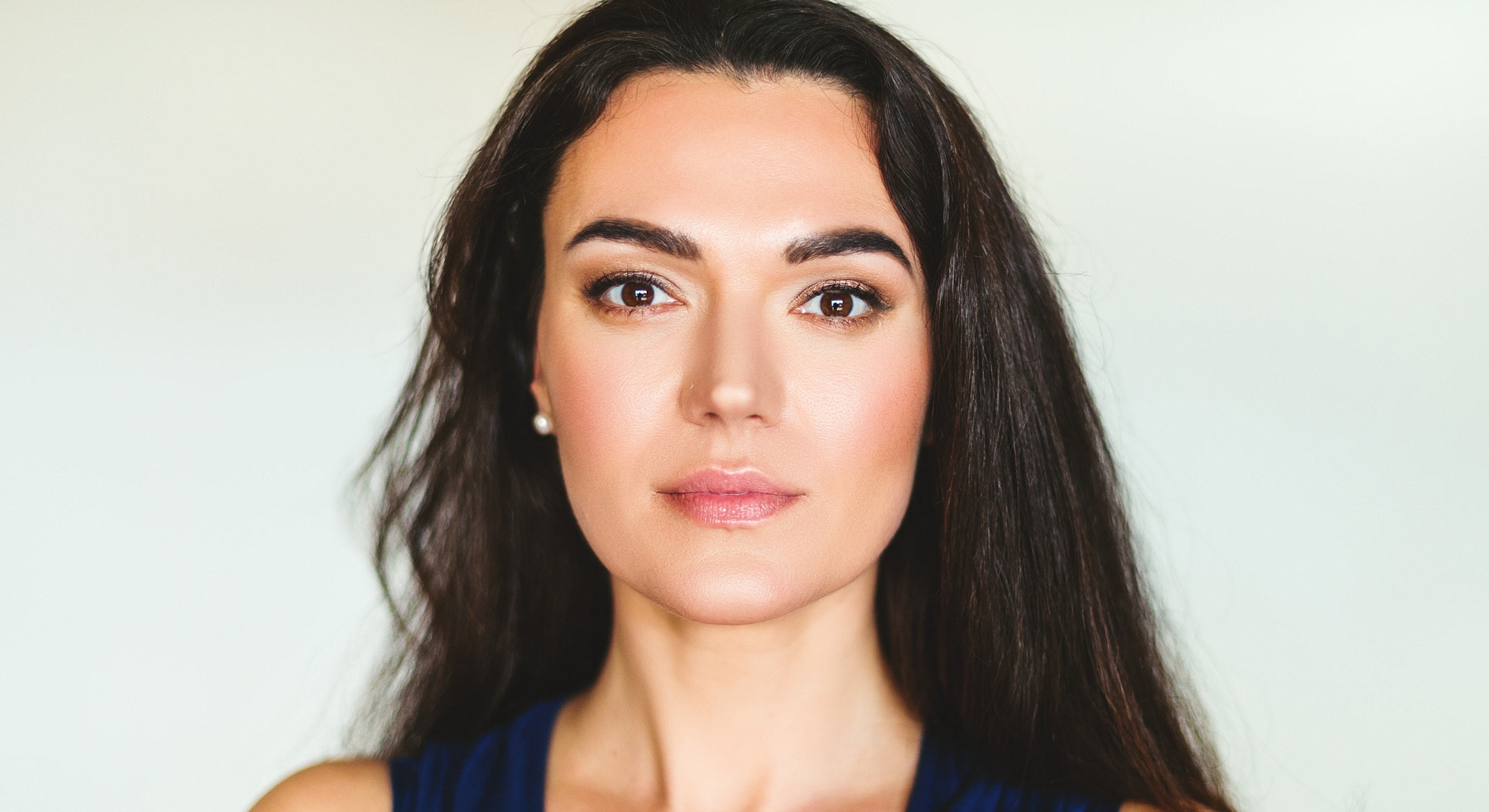 Portrait of a woman with long dark hair.