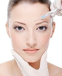 provider preparing dysport injection for facial wrinkles