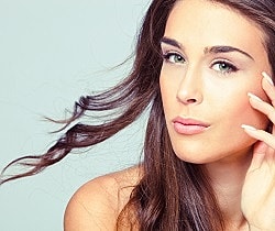 Woman smiling after Juvéderm filler for smile lines