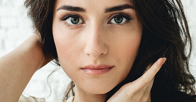 Woman with smooth cheeks after Juvéderm filler