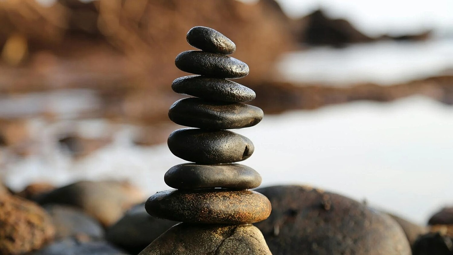 Pile of Rocks by Body of Water