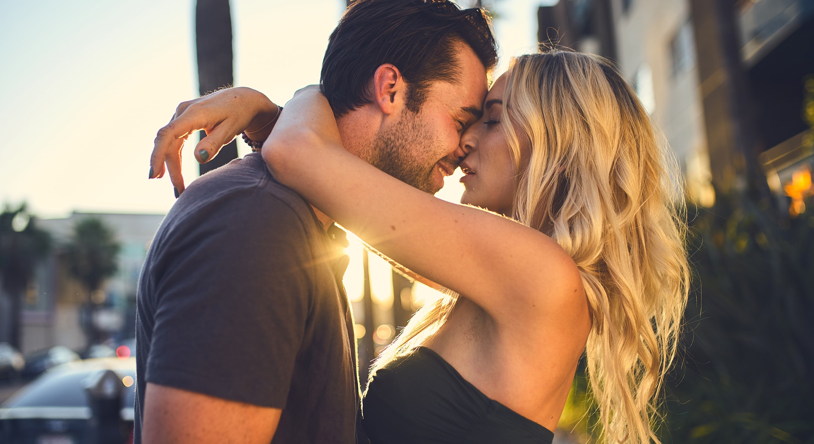 Couple sharing a romantic moment outdoors.