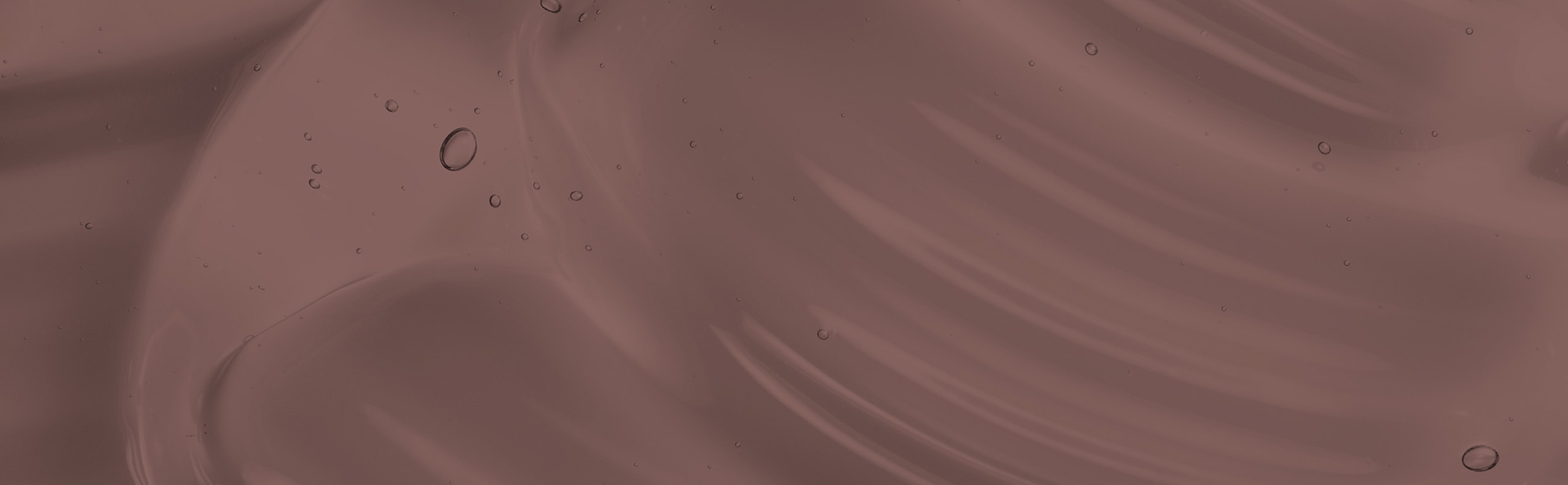 Abstract maroon texture with subtle water droplets.