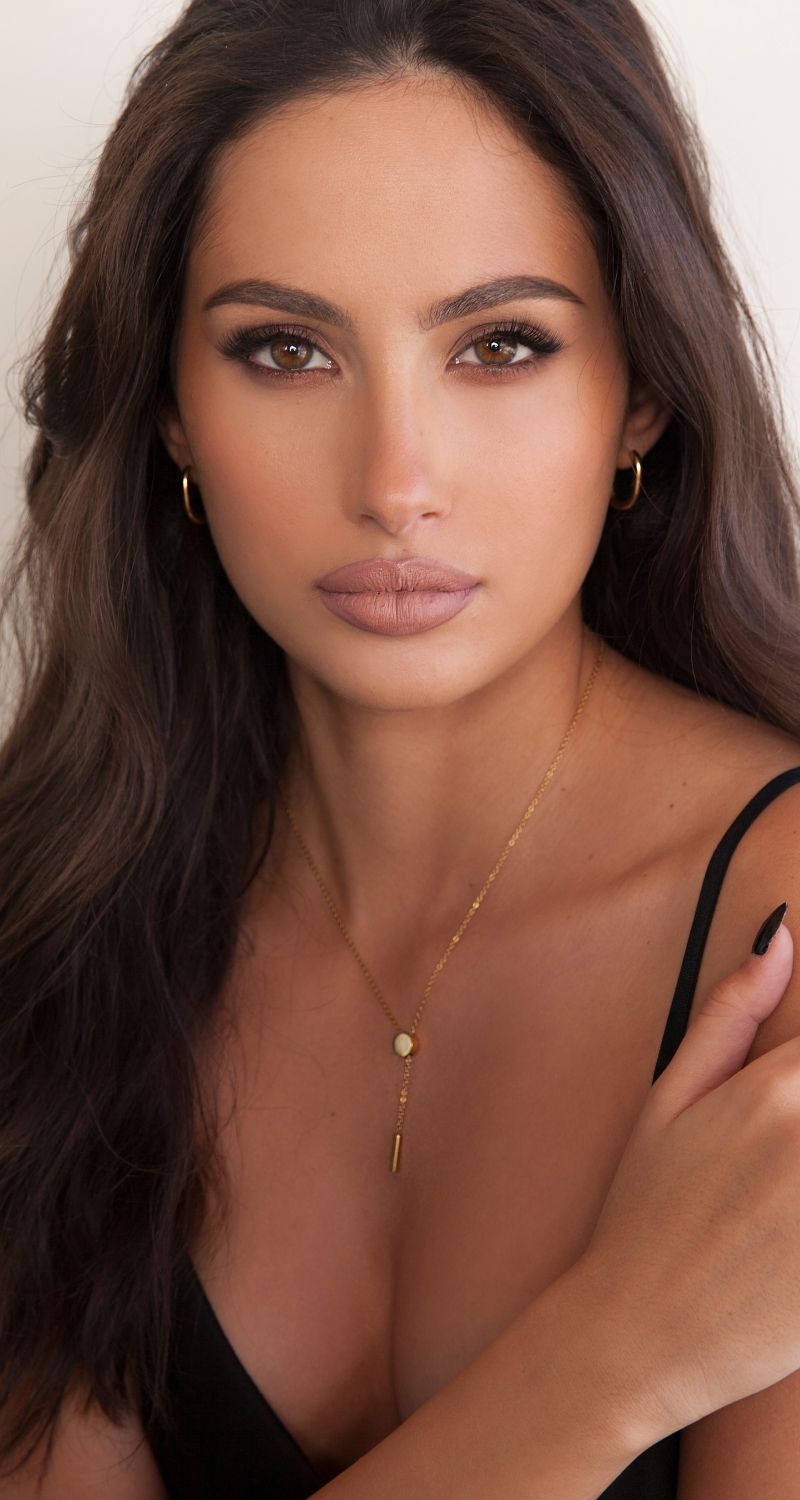 med spa patient model with long, wavy hair.