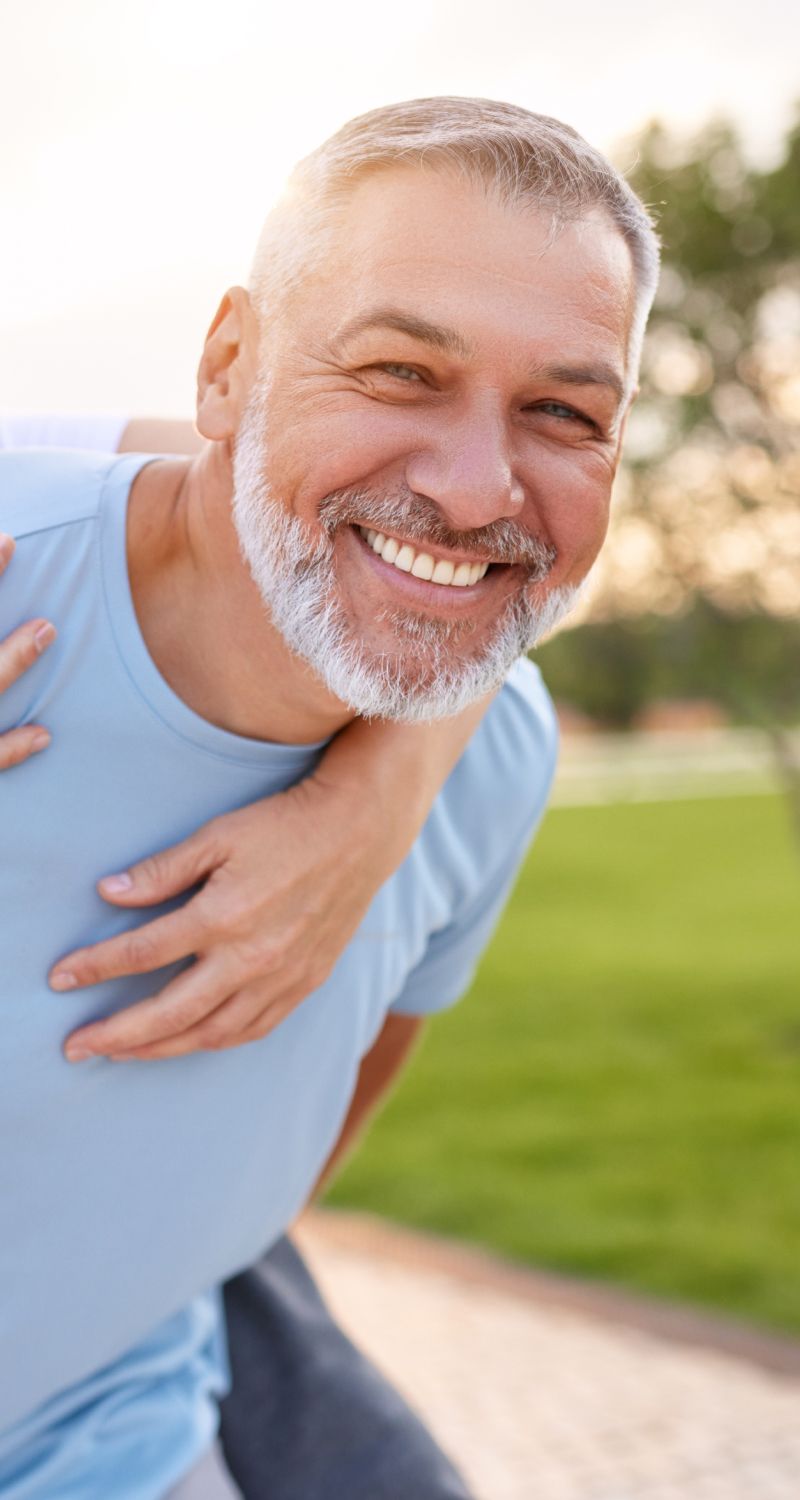 Smiling med spa patient model enjoying time outdoors.