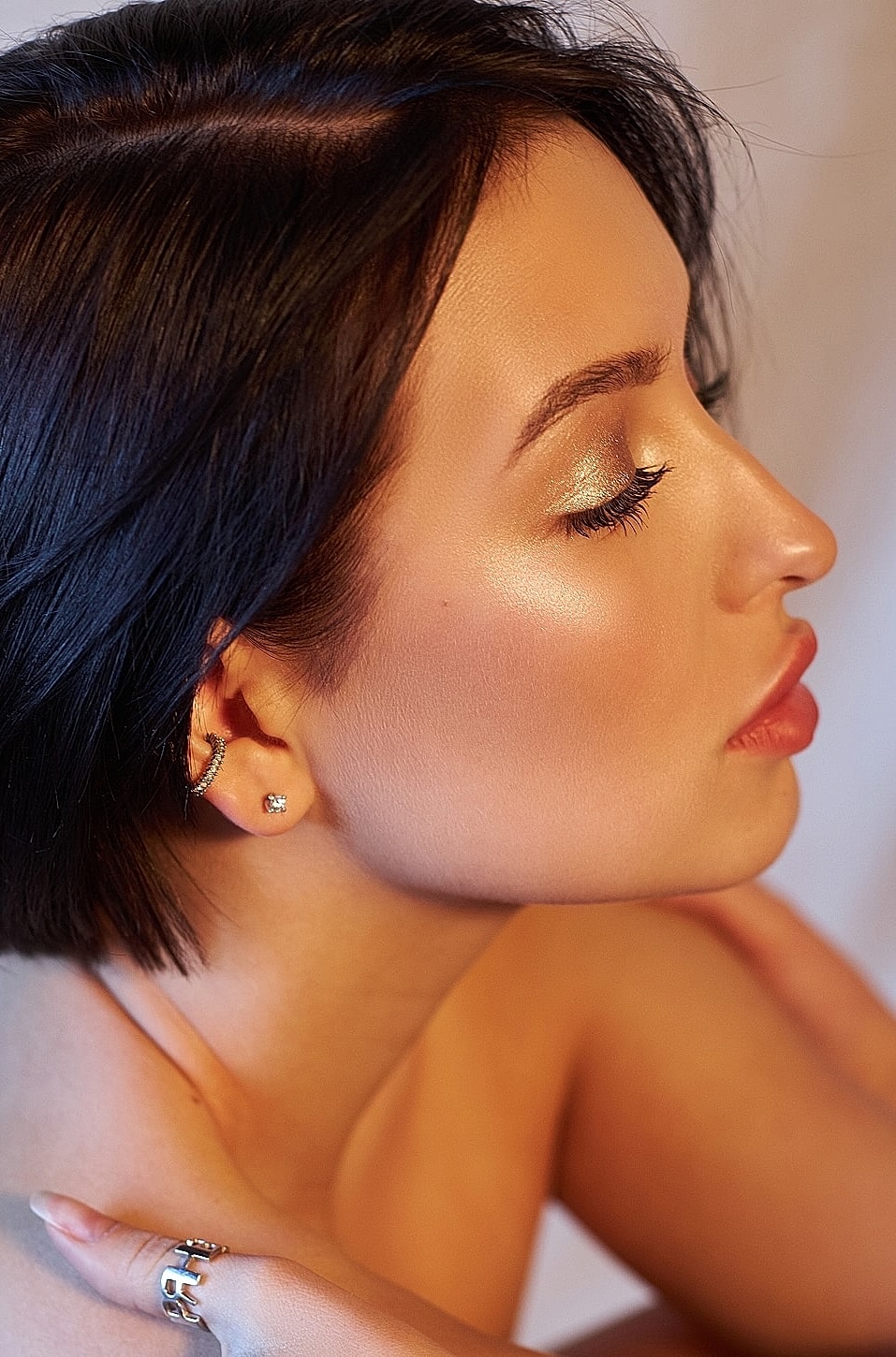 Profile view of woman with glowing skin.