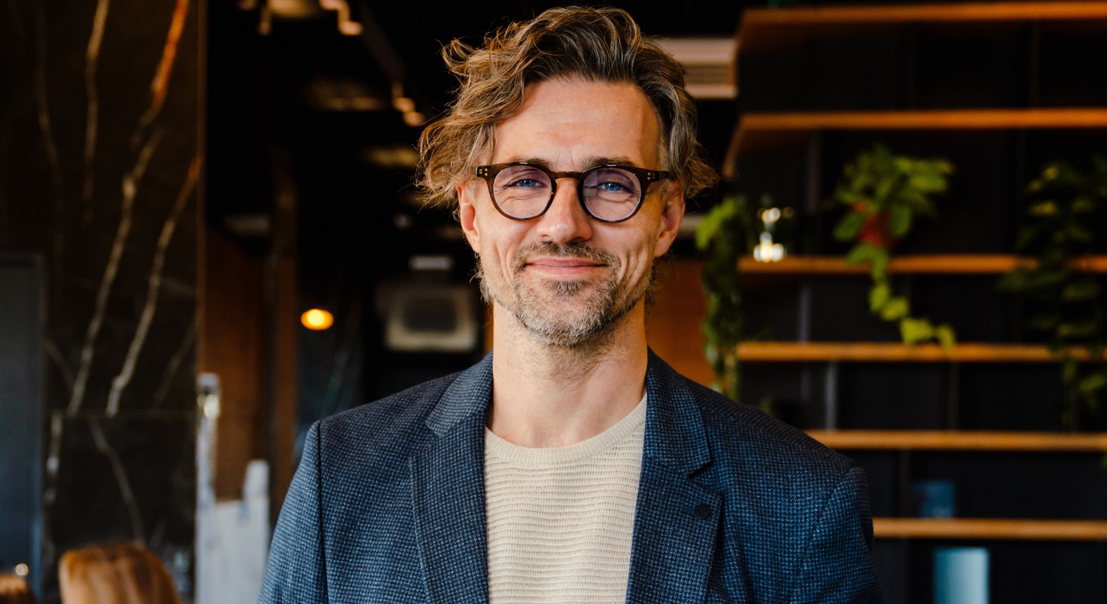 st louis hair services model wearing glasses