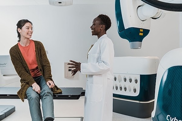 Female doctor talking to a female patient in a doctor's office