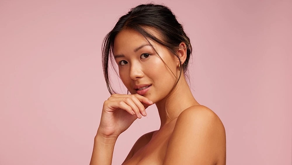 Woman with flawless skin and a soft smile representing Botox beauty results.