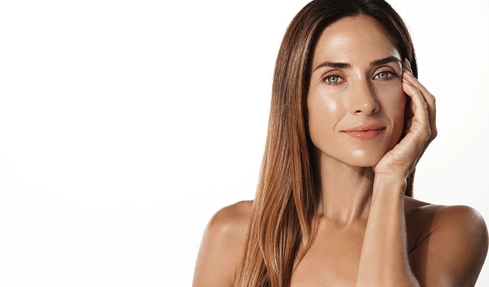 Confident woman showing smooth jawline after Morpheus8.