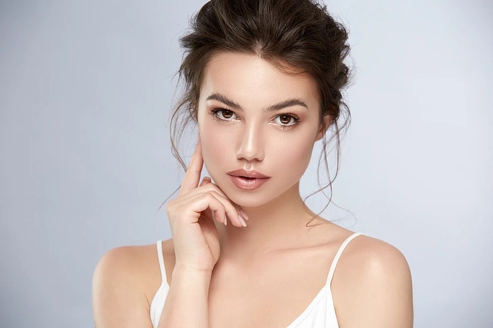Woman with radiant skin after Halo laser treatment.