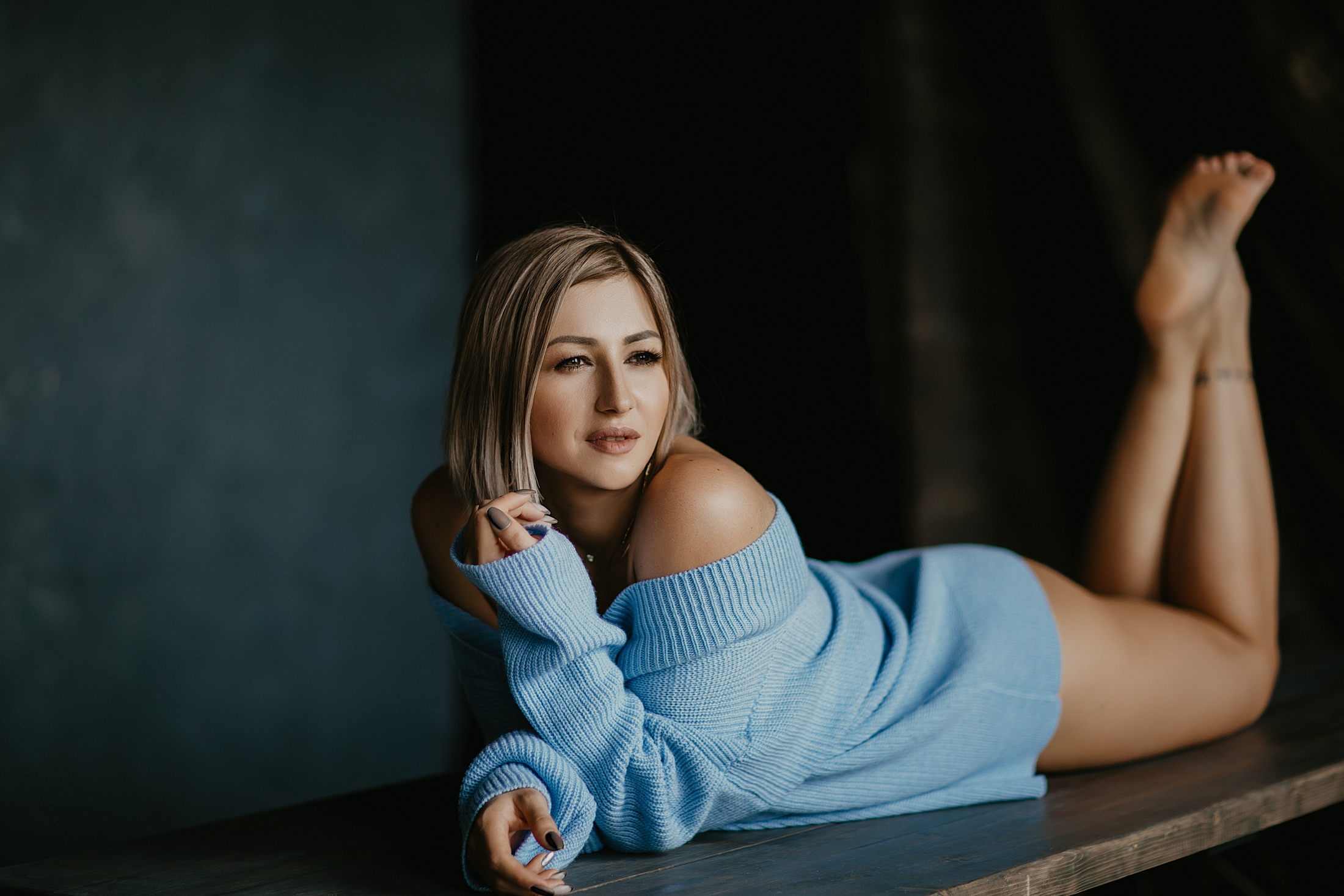 houston buttock lift surgeon in a blue sweater