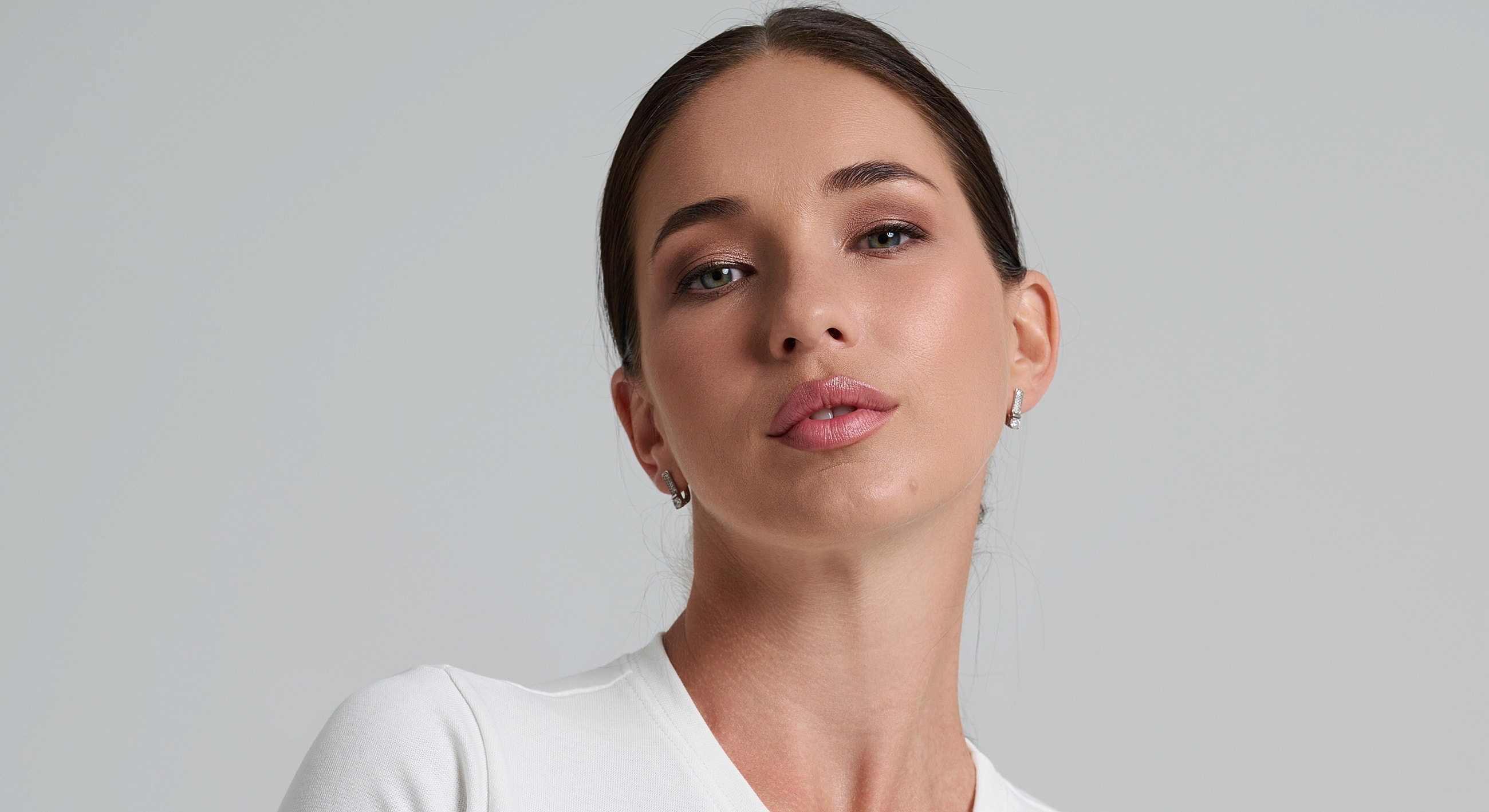 Portrait of a woman with a neutral expression.