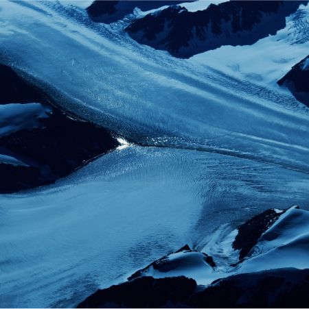 Glacial landscape with flowing ice and water.