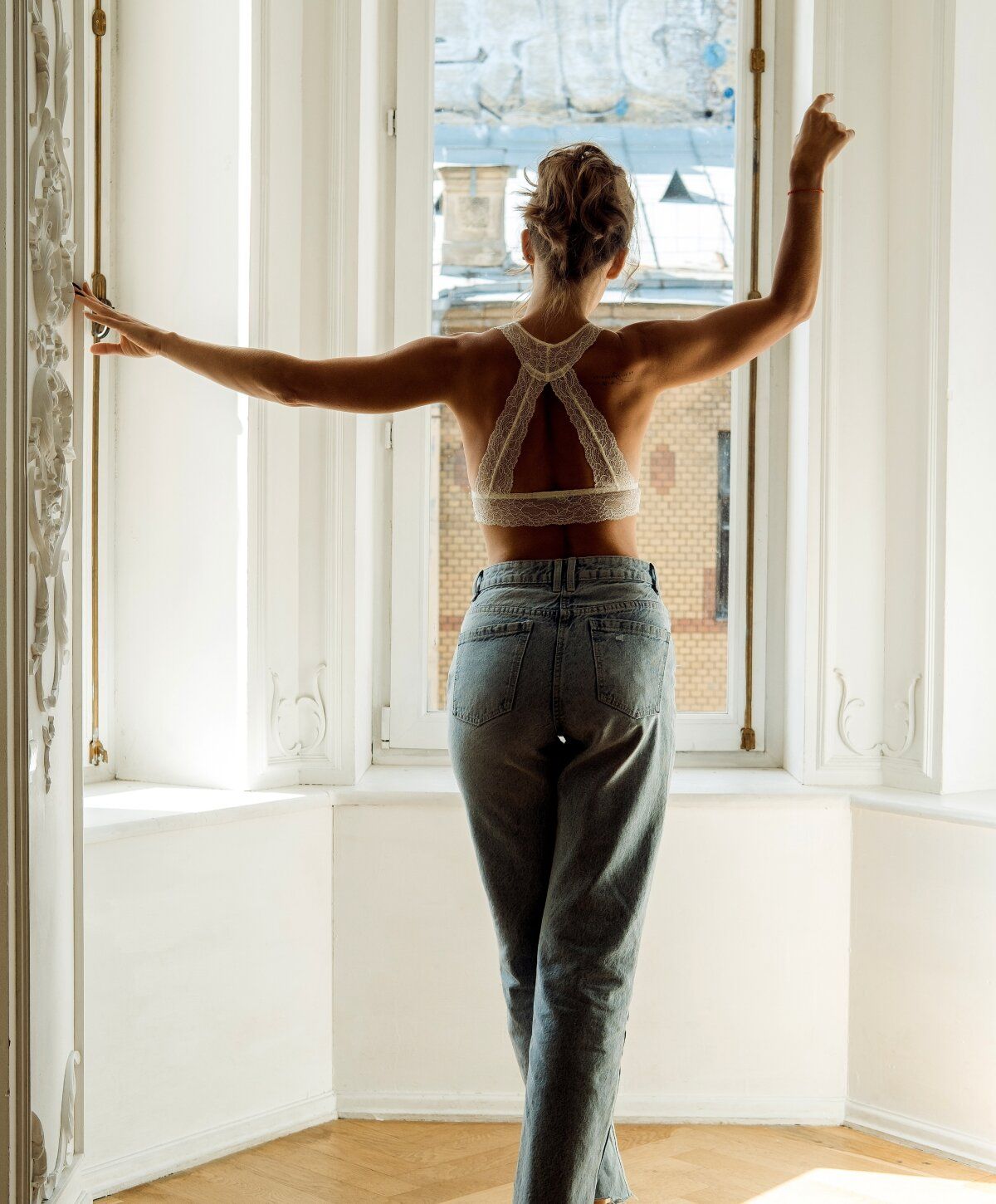 santa rosa loose skin model standing at window