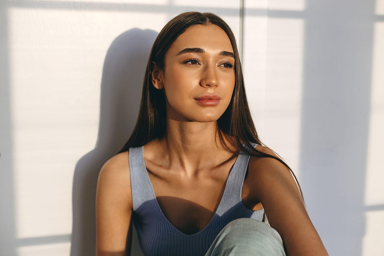 Woman considering breast implant revision and treatment for capsular contracture.