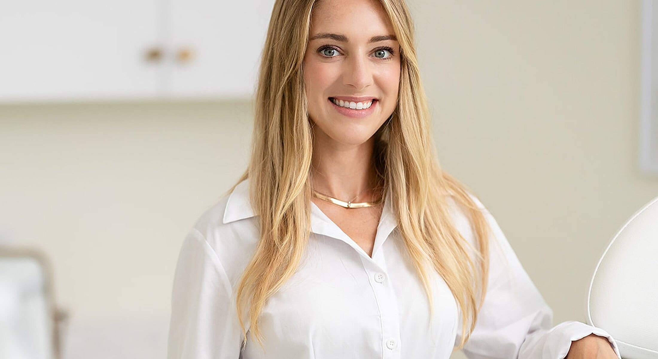 Smiling woman in a professional setting.
