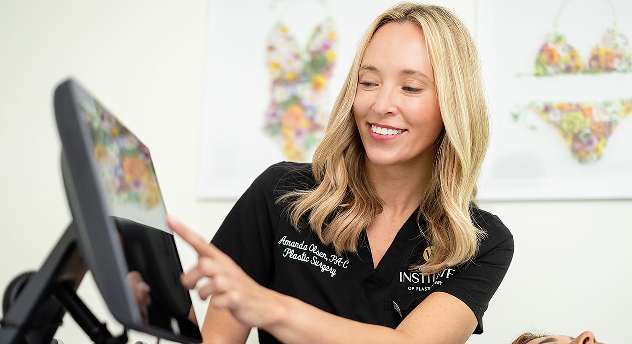 Medical professional using a digital display in office.