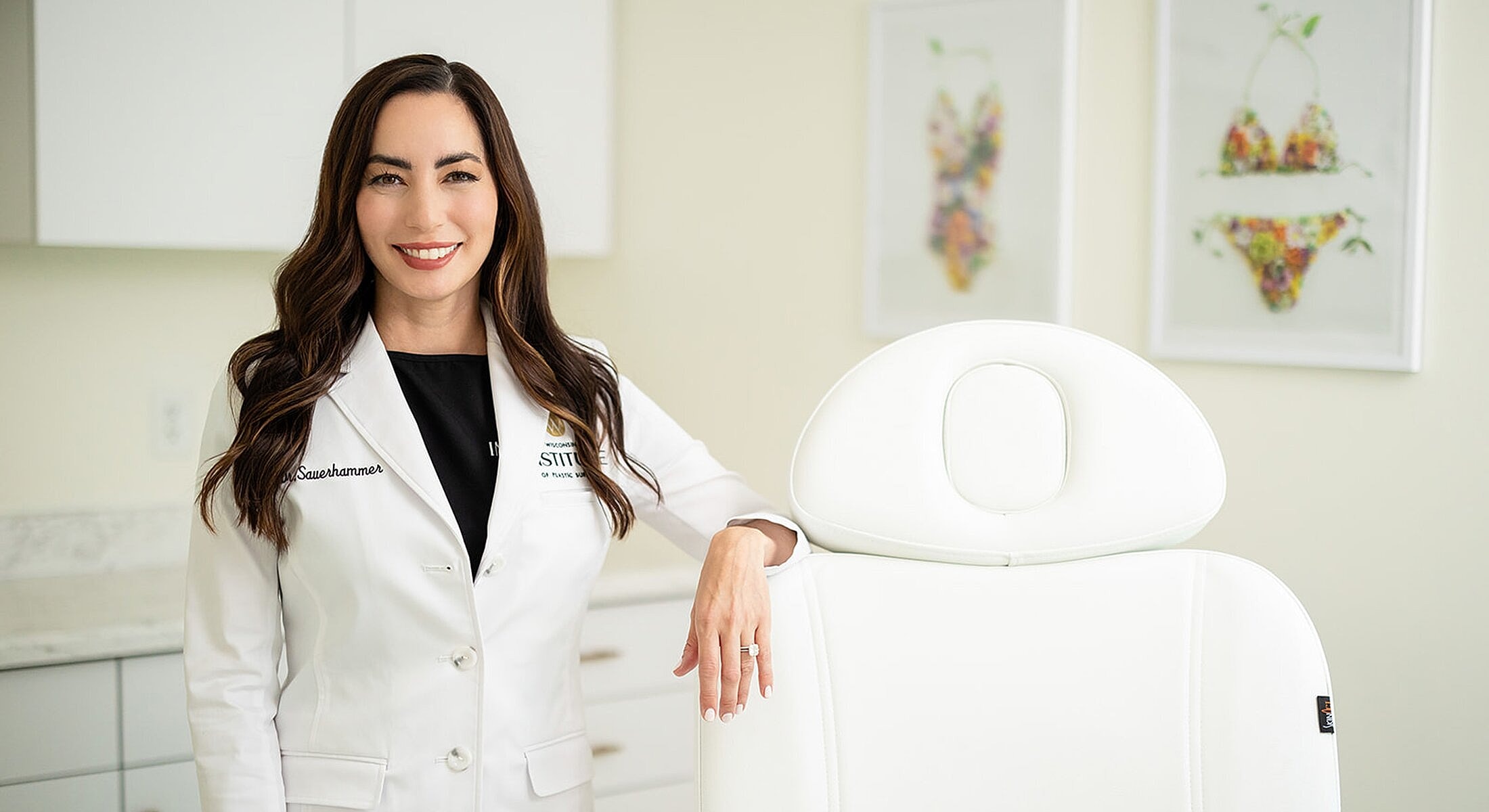 Professional woman in clinic setting, smiling.