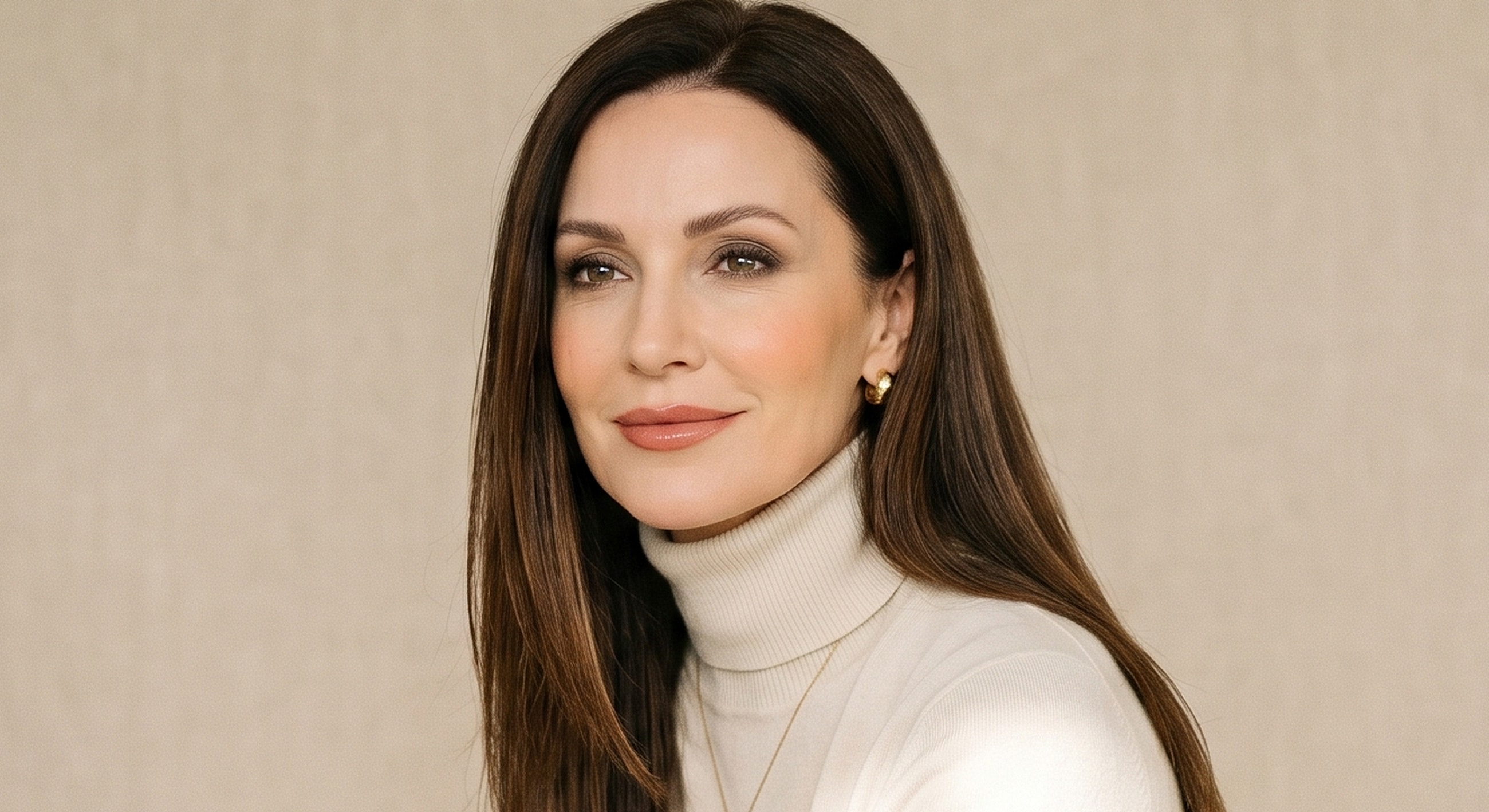 Woman with long hair wearing a turtleneck.