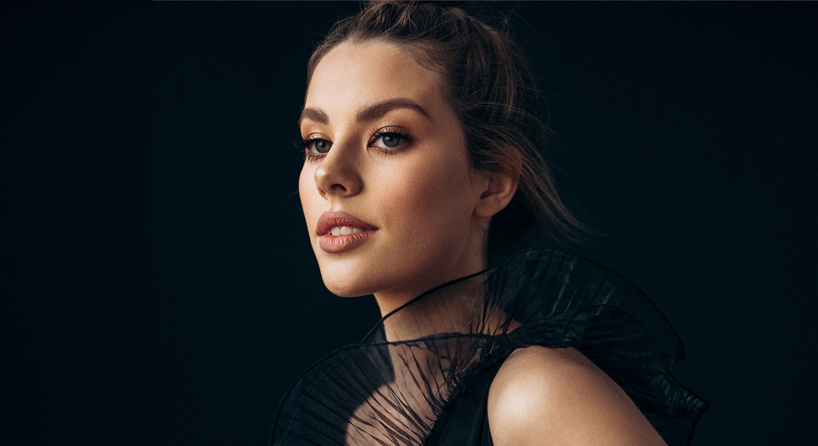 Profile of a woman with elegant hairstyle.