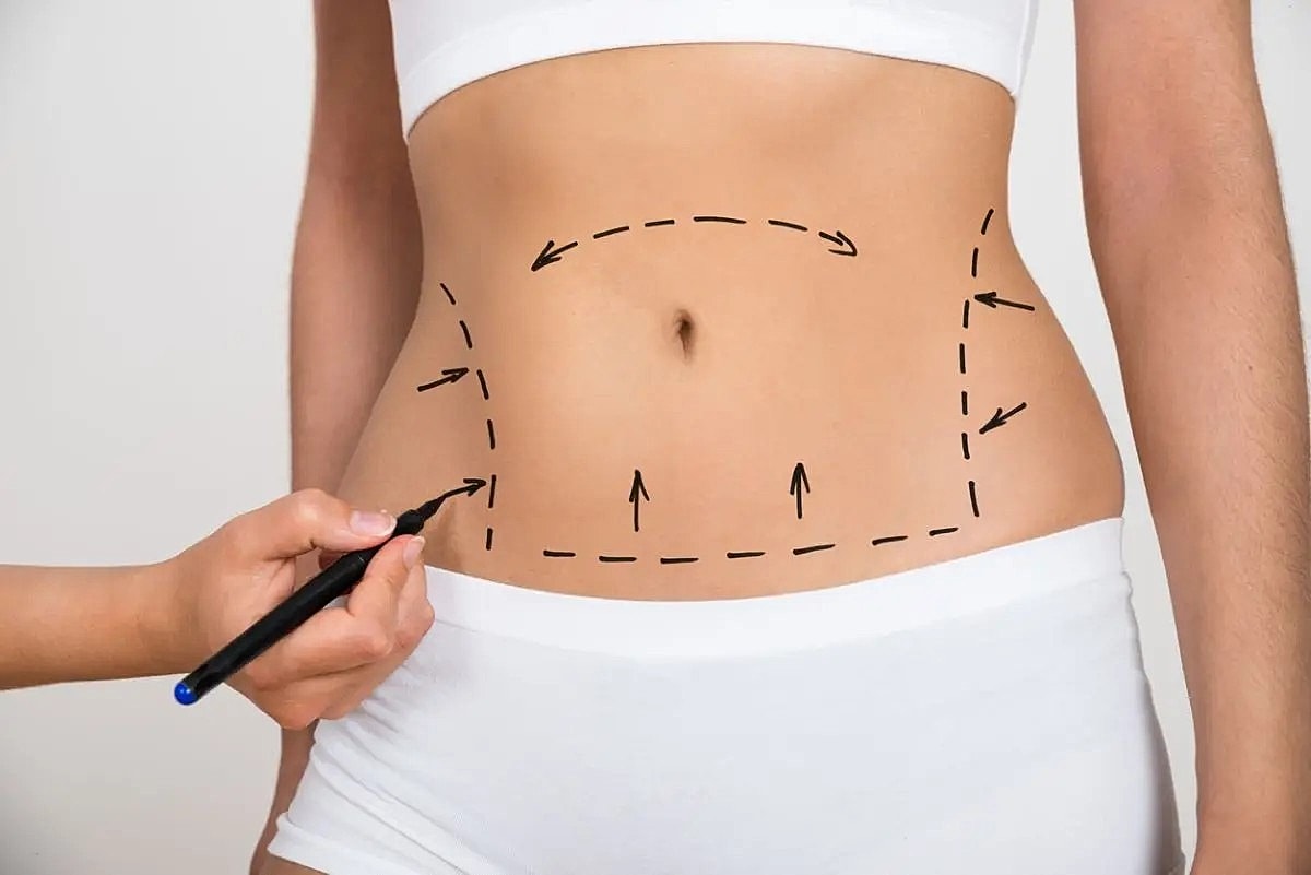 Body contouring design on a woman's abdomen.
