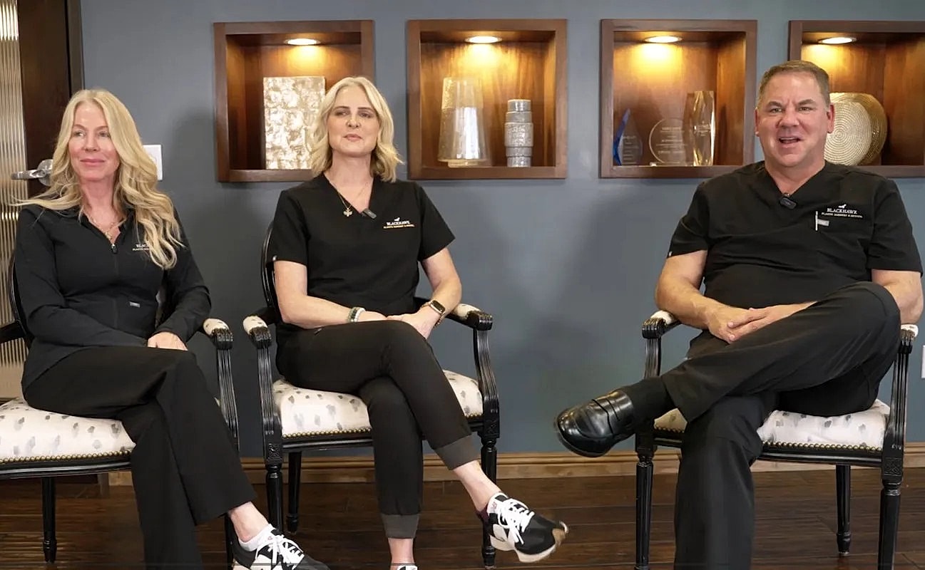 Medical professionals sitting in a modern office.