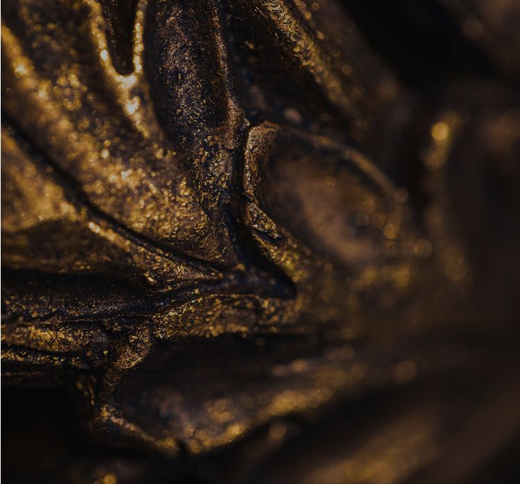 Close-up of textured gold surface.