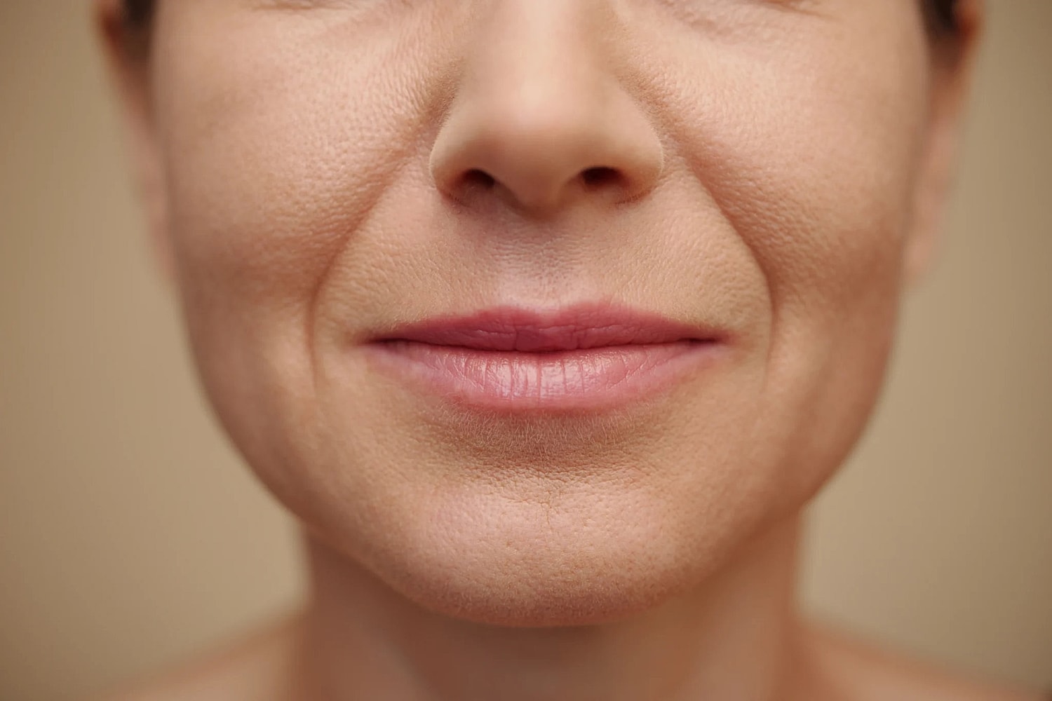 Close-up of smiling woman's face and lips.