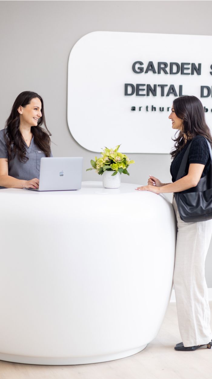 clark patient speaking with receptionist