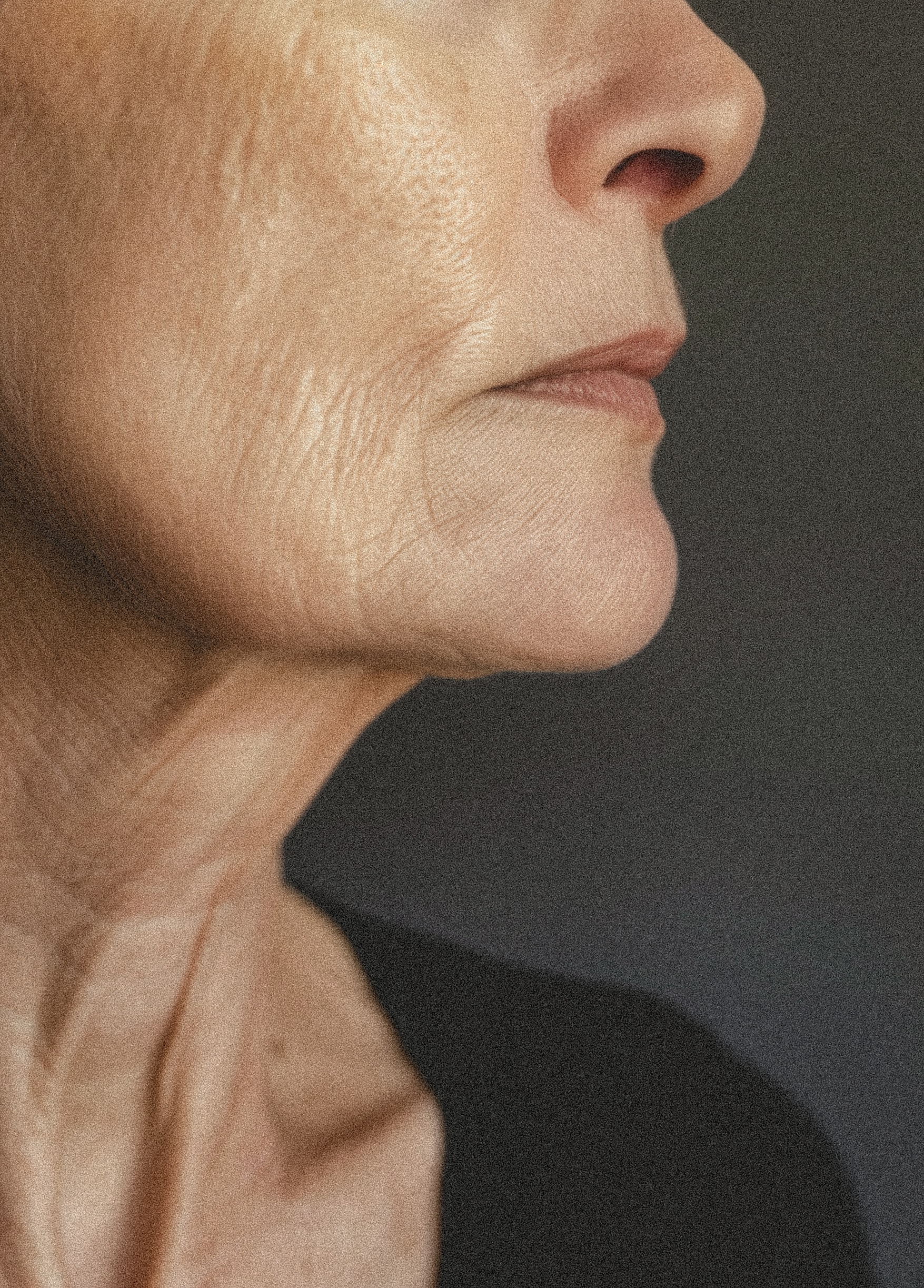 Close profile showing natural texture along the jawline and neck