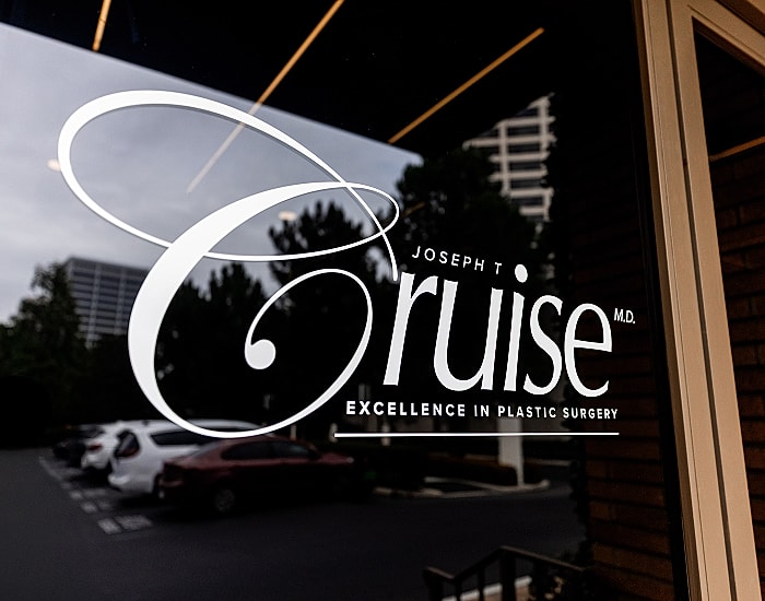 Plastic surgery clinic window sign and logo.