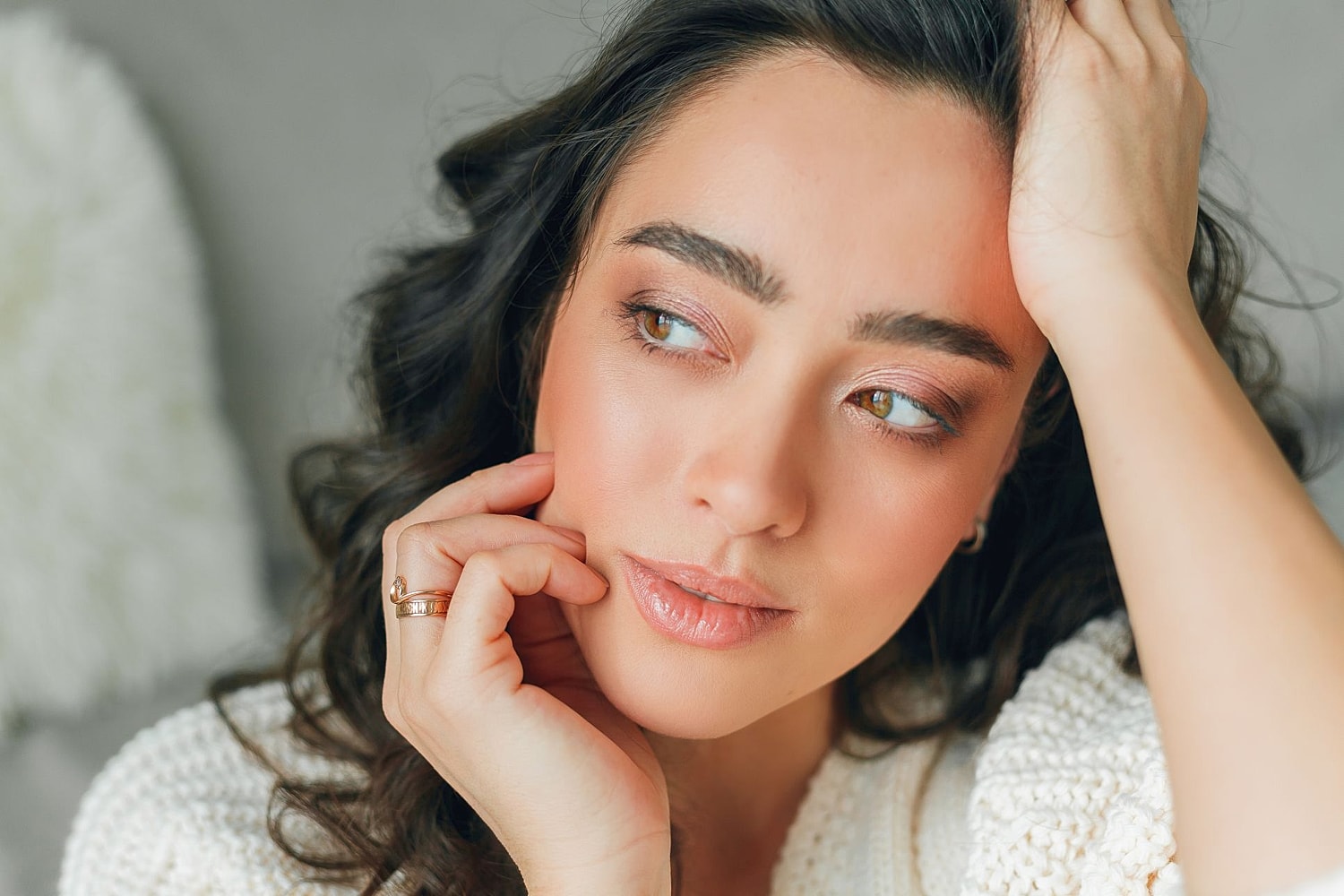 Woman with smooth glowing skin and even complexion after Moxi laser treatment for sun damage and texture