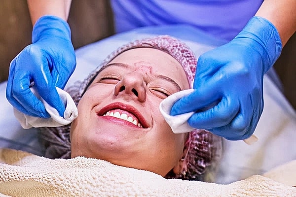 happy girl teenager on the procedure at the beautician, cleaning