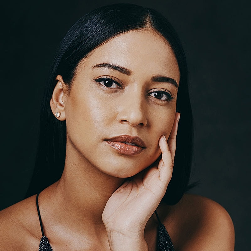 Woman with long hair and subtle makeup.