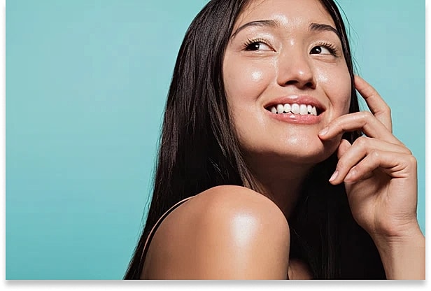 Close,Up,Of,Cute,Asian,Girl,With,Glowing,Skin,Against