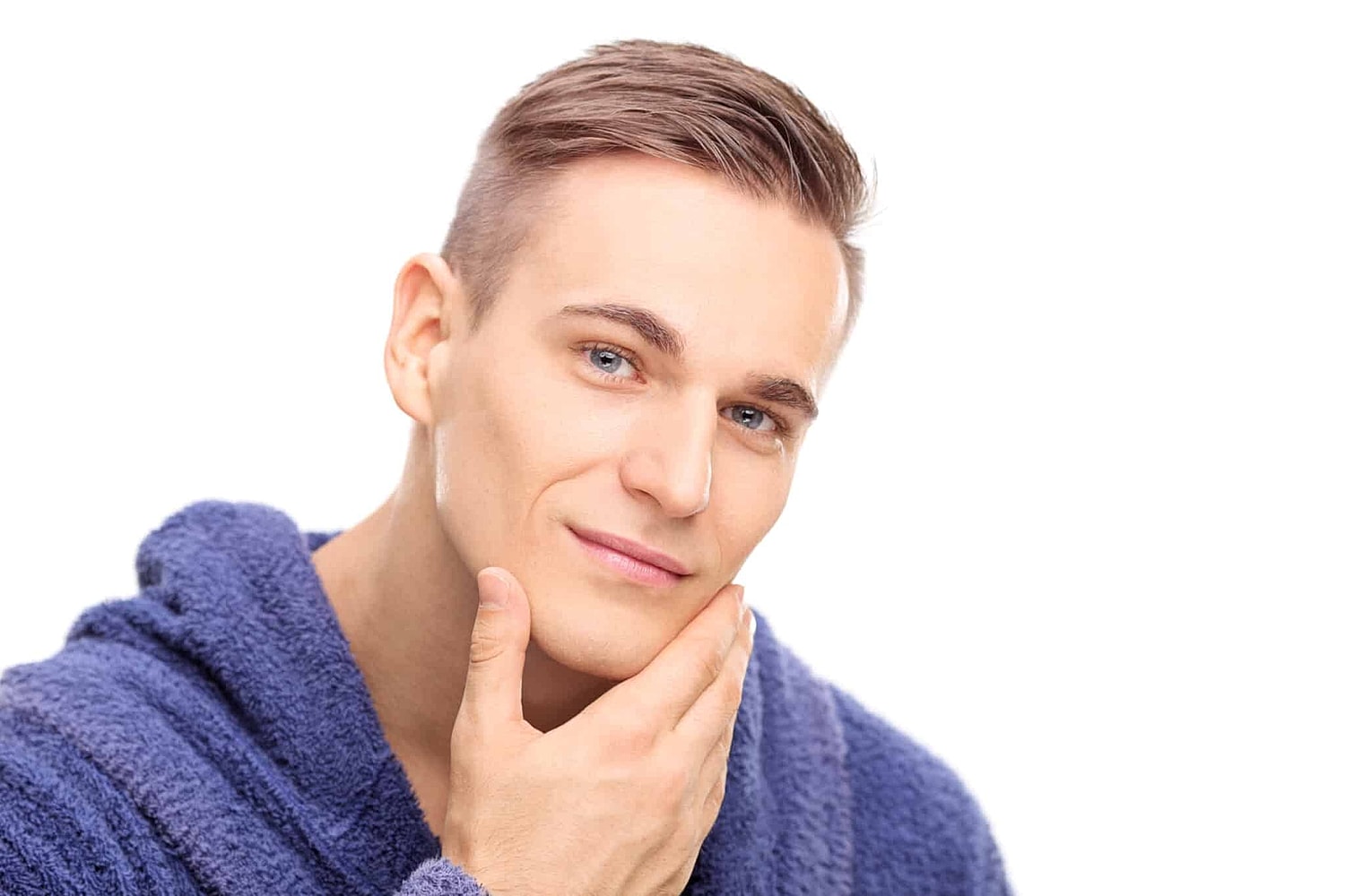 A man smiling with his hand on his chin after getting chin filler in Coral Gables