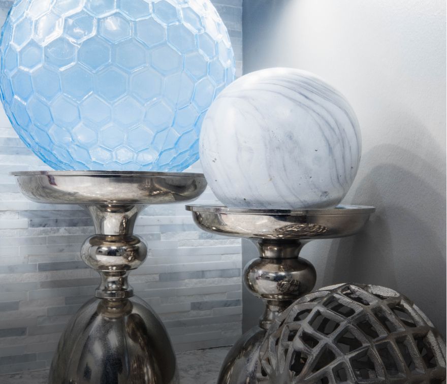 Decorative glass orbs on metal stands