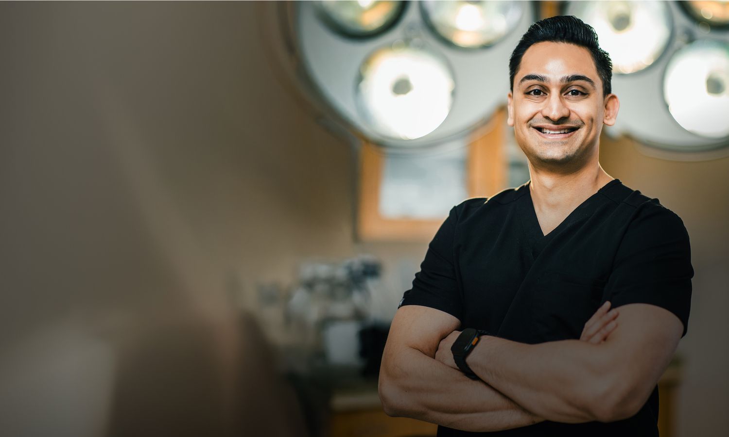 St. Louis plastic surgeon, Dr. Kacharek in surgical attire.