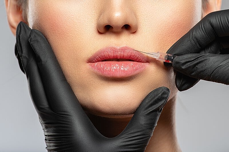 Woman's face close up getting botox