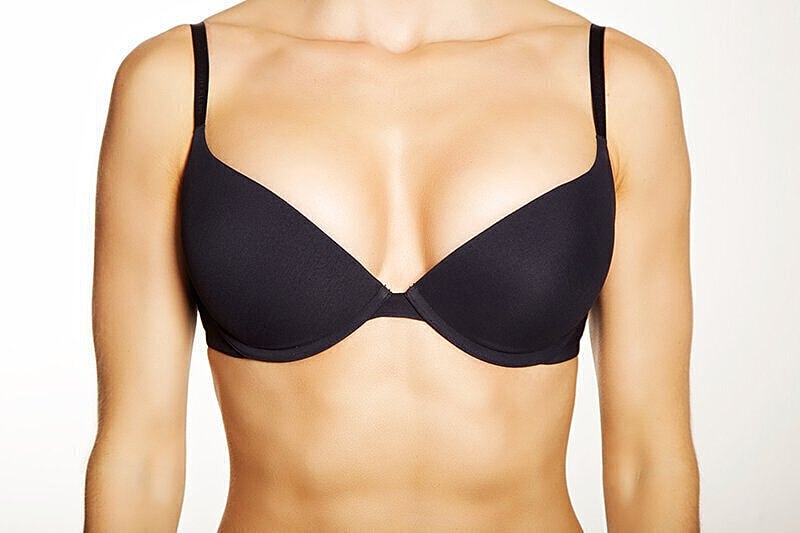Woman's torso wearing black bra