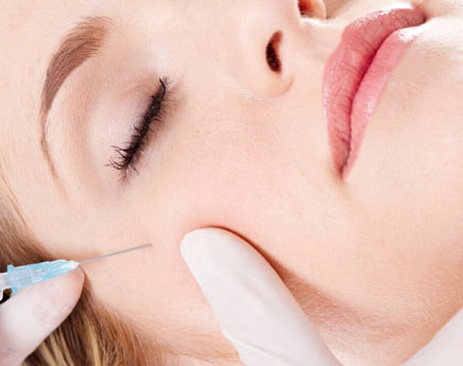 Dermal fillers patient with smooth skin receiving injection