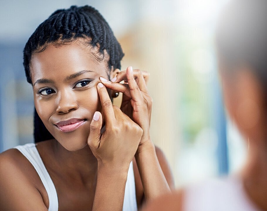 Woman addressing acne